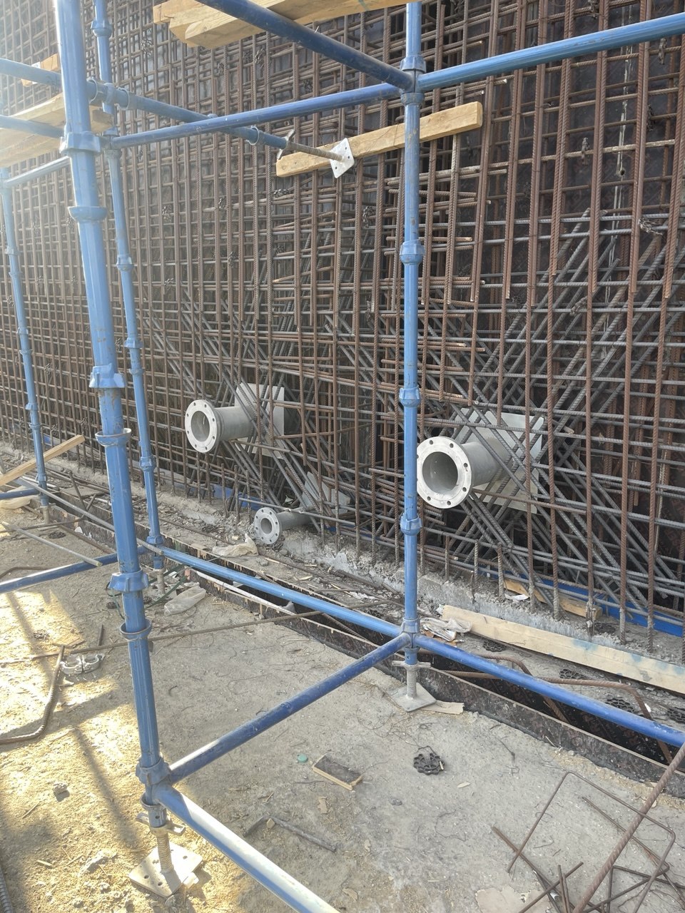 Embedded steel sleeves and pipe penetrations in reinforced concrete wall
